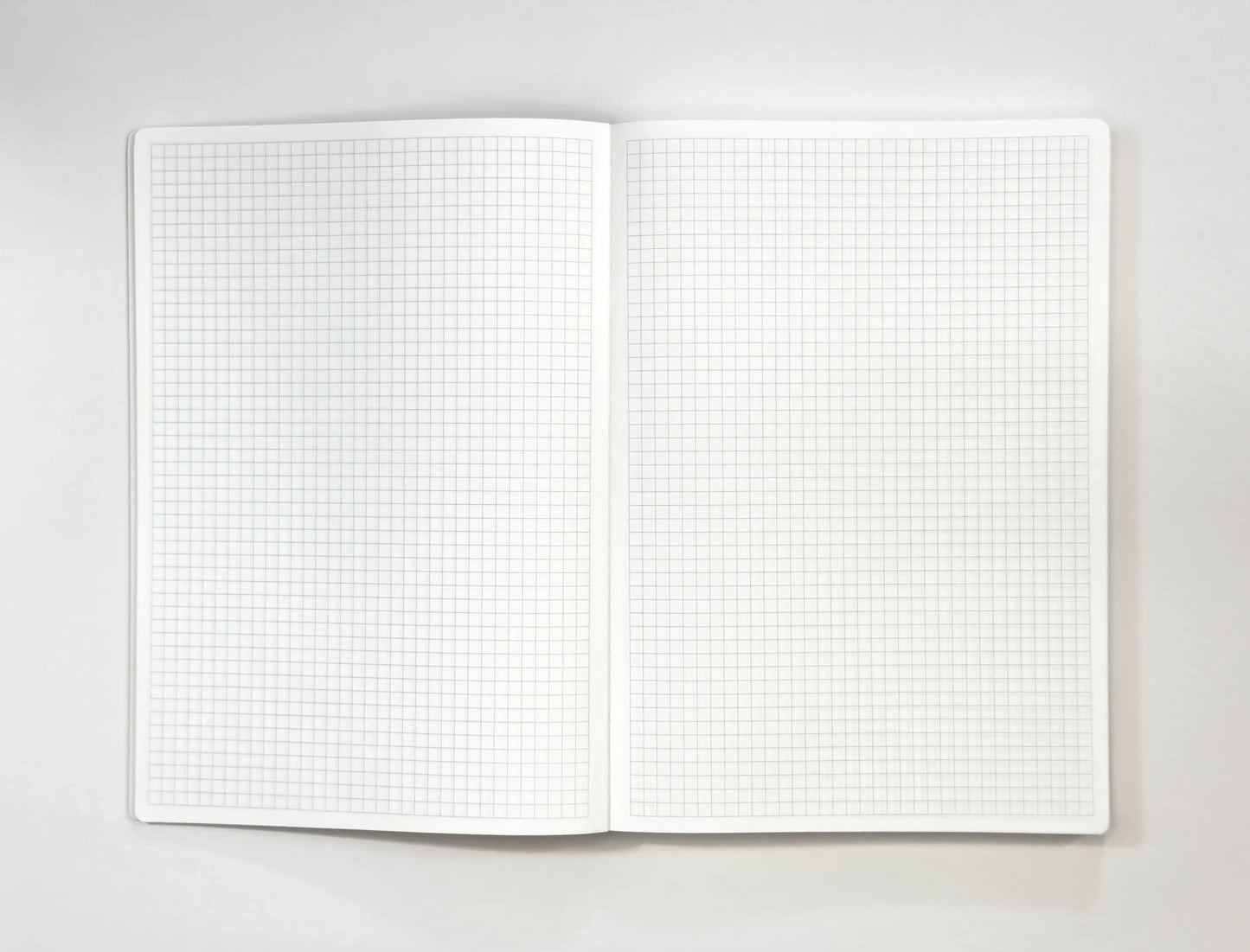 A5 notebook open Tomoe River paper grid