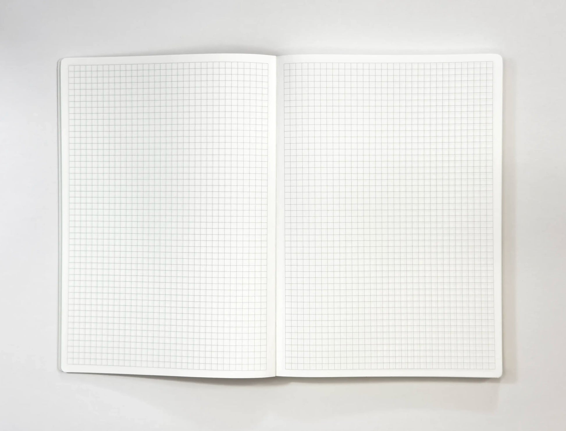 A5 notebook open Tomoe River paper grid